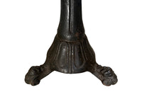 19th Century French carved wooden ships chair with leather seat and heavy cast iron base.