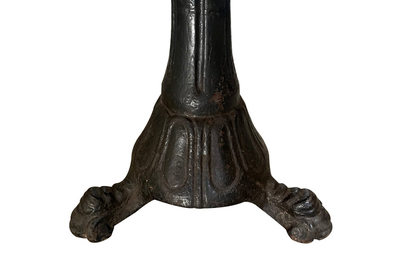 19th Century French carved wooden ships chair with leather seat and heavy cast iron base.