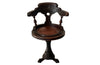 19th Century French carved wooden ships chair with leather seat and heavy cast iron base.