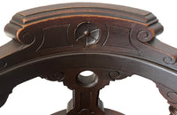 19th Century French carved wooden ships chair with leather seat and heavy cast iron base.