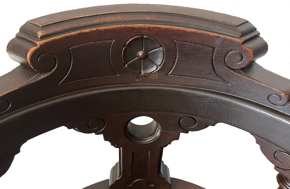 19th Century French carved wooden ships chair with leather seat and heavy cast iron base.