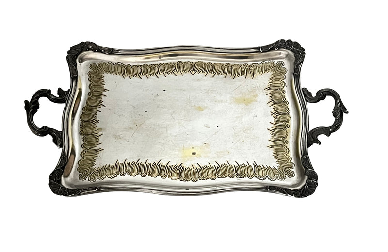 Decorative early 20th Century French Louis XV style worn silver plate on brass tray with ornate handles.