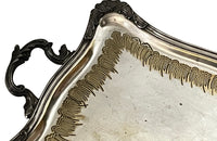 Decorative early 20th Century French Louis XV style worn silver plate on brass tray with ornate handles.