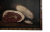 Signed still life painting depicting a glass of ale, cured meat, bread, knife and bottle on a table with chair