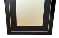 Stylish, black acrylic framed mirror with brass banding. Italy circa 1970