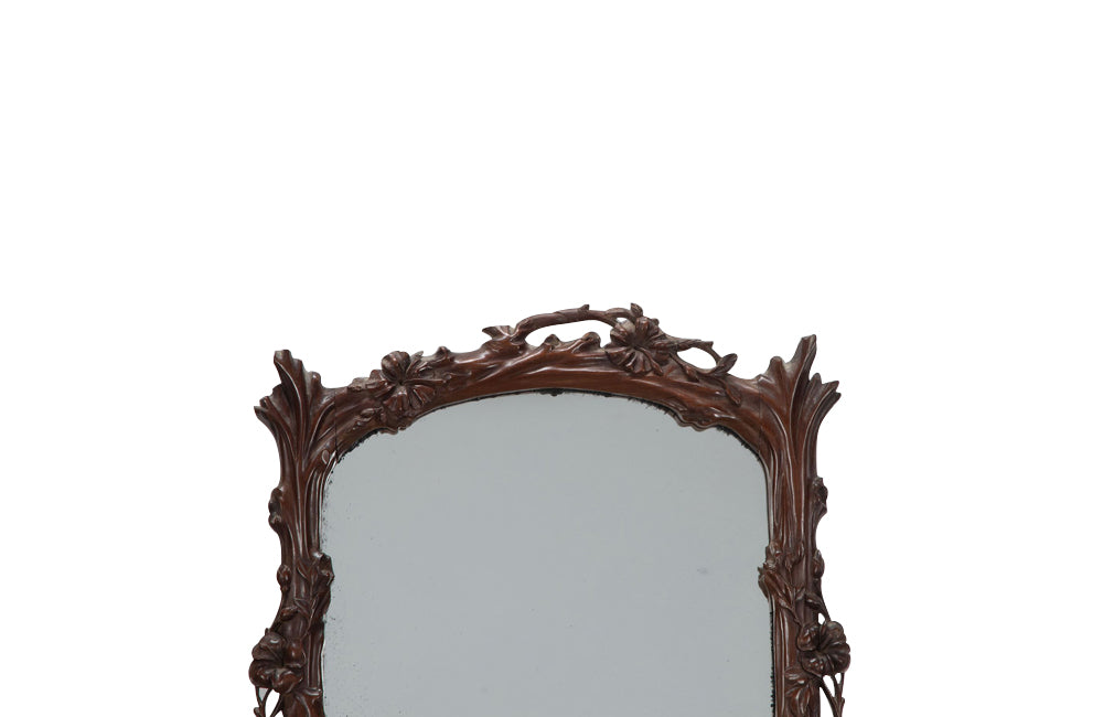 Pair of 20th Century decorative mirrors carved with climbing branches and flowers.&nbsp;