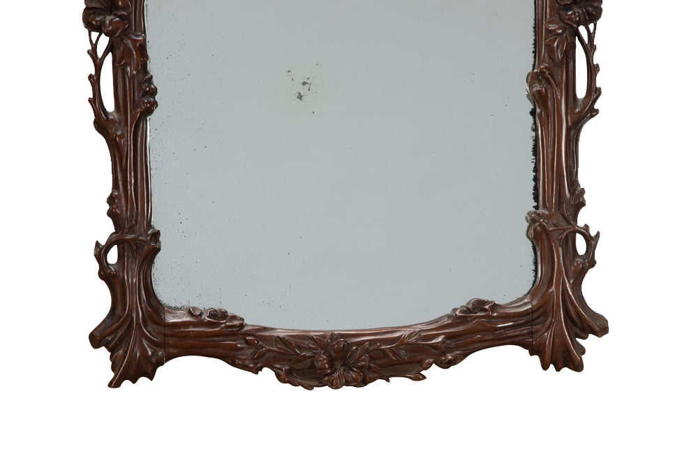 Pair of 20th Century decorative mirrors carved with climbing branches and flowers.&nbsp;