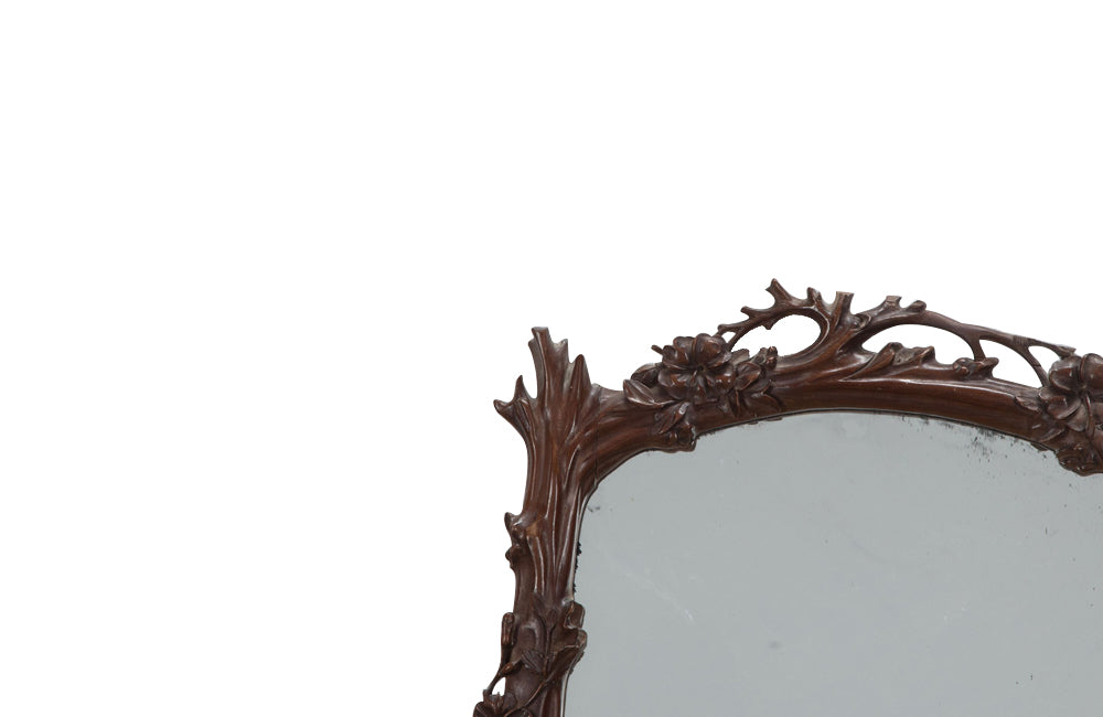 Pair of 20th Century decorative mirrors carved with climbing branches and flowers.&nbsp;