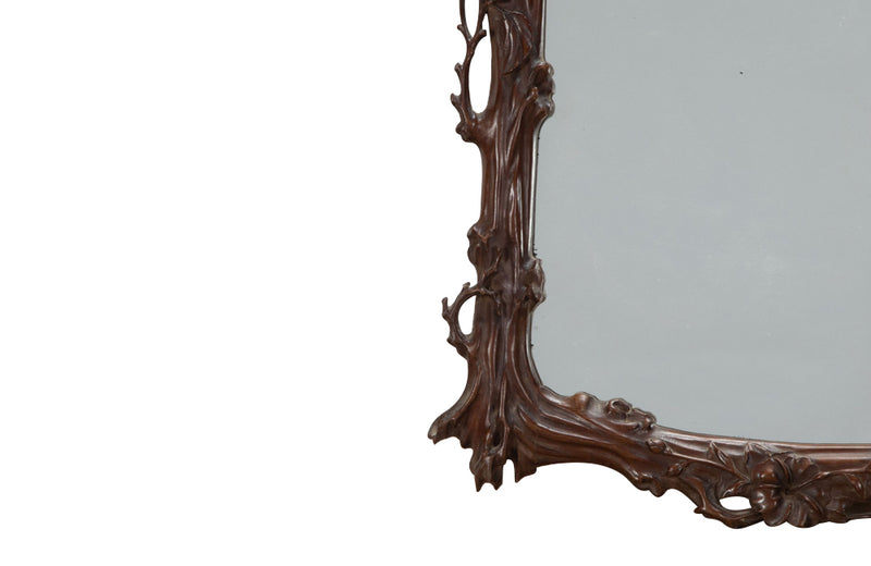 Pair of 20th Century decorative mirrors carved with climbing branches and flowers.&nbsp;