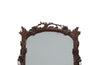 Pair of 20th Century decorative mirrors carved with climbing branches and flowers.&nbsp;