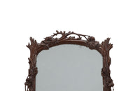 Pair of 20th Century decorative mirrors carved with climbing branches and flowers.&nbsp;