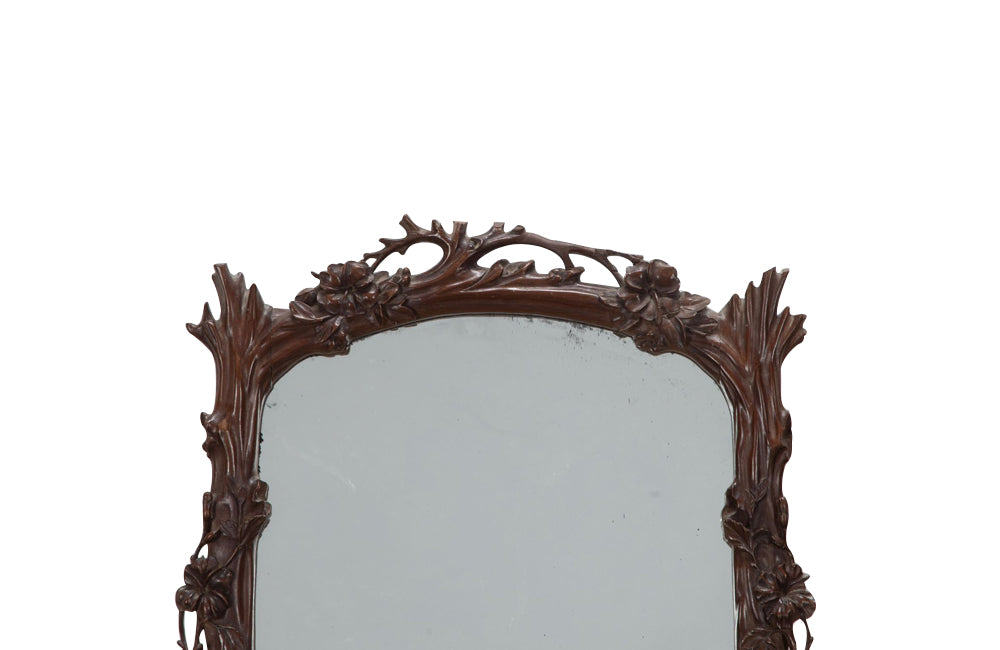 Pair of 20th Century decorative mirrors carved with climbing branches and flowers.&nbsp;