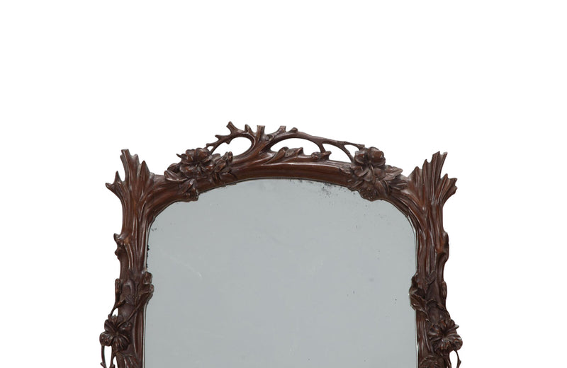 Pair of 20th Century decorative mirrors carved with climbing branches and flowers.&nbsp;