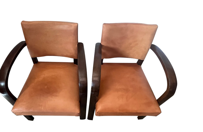 Art Deco style bridge chair armchairs with wide arched arms that incorporate the front legs, in the manner of Jindřich Halabala - 