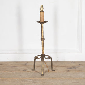 Mid Century Spanish gilt iron table lamp with fluted cup, hammered ringed stem terminating on tripod base with scrolled iron work. 