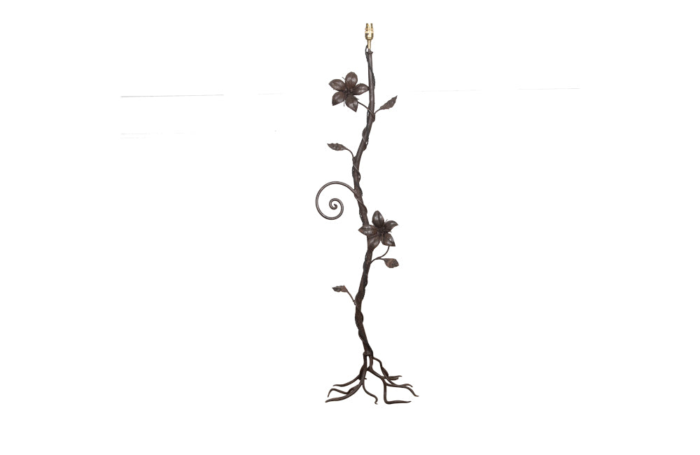 decorative wrought iron floor lamp in the form of a climbing flowering plant