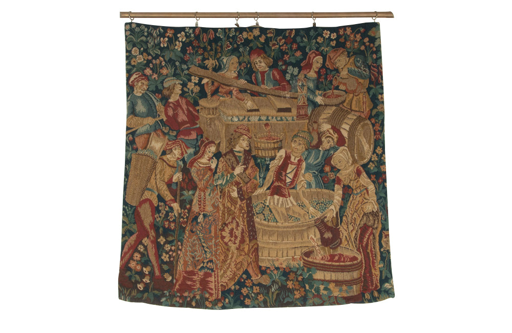 Antique tapestry wall hanging titled 'Le Pressage depicting wine pressing in XV Century Medieval times. French antiques