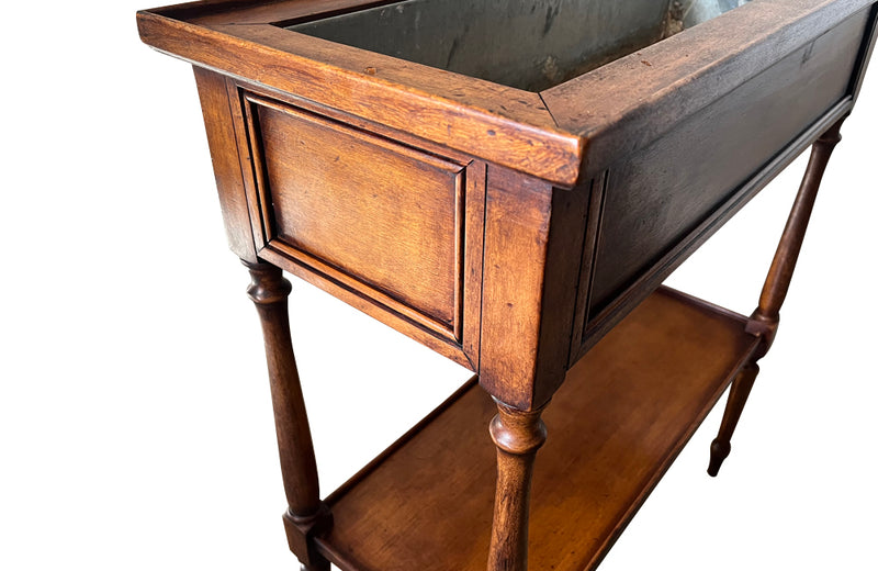 Elegant, Louis XVI Revival cherry wood jardiniere with zinc liner.