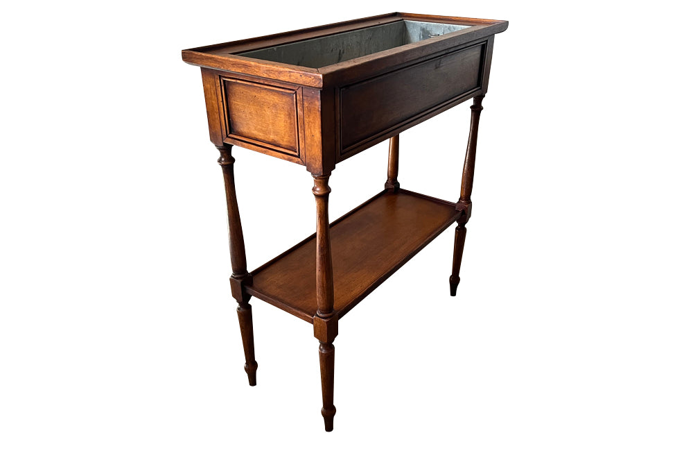 Elegant, Louis XVI Revival cherry wood jardiniere with zinc liner.