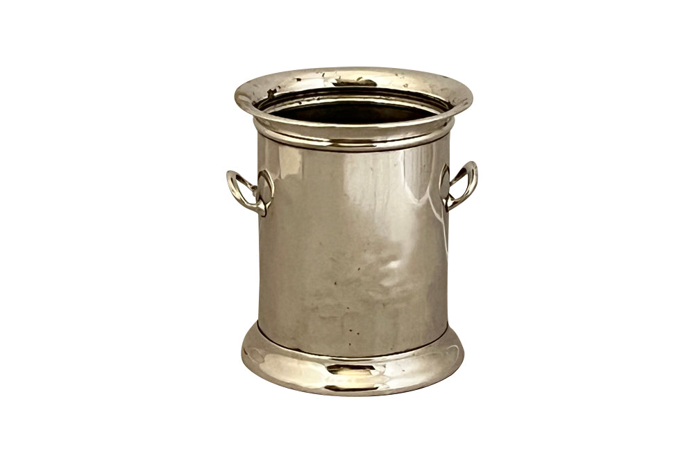 Elegant French silver plate bottle holder with two side handles.