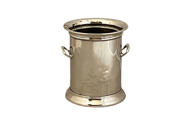 Elegant French silver plate bottle holder with two side handles.