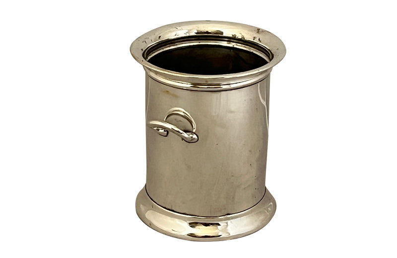 Elegant French silver plate bottle holder with two side handles.