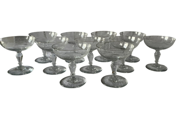 Beautiful set of 11 French champagne coupes decorated with a neo-classical etched design featuring galands of flowers.  c.1900