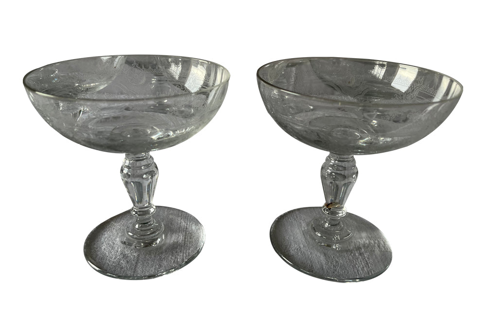 Beautiful set of 11 French champagne coupes decorated with a neo-classical etched design featuring galands of flowers.  c.1900