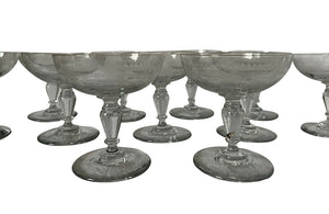 Beautiful set of 11 French champagne coupes decorated with a neo-classical etched design featuring galands of flowers.  c.1900