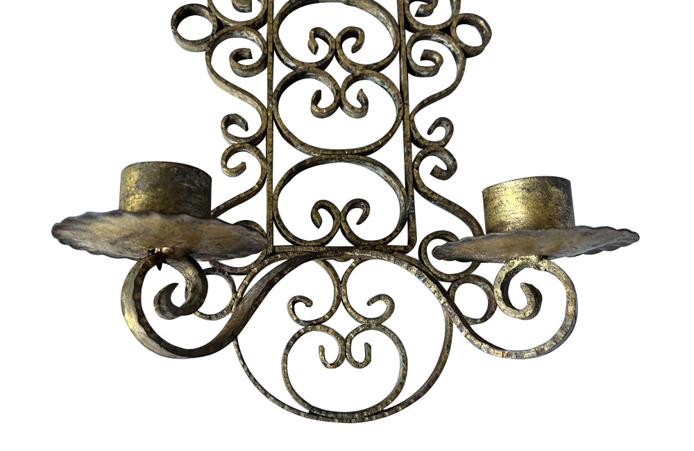 Pair of mid 20th Century Spanish gilt scroll work iron wall sconces.
