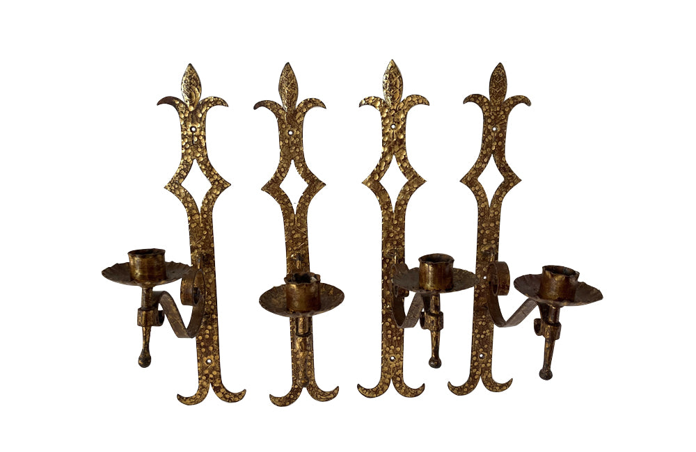 Set of 20th century Spanish decorative four gilt iron wall appliques. 