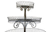 Antique metal plant stand made of iron work with three tiers