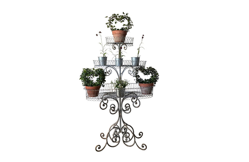 Large French iron wirework florists plant stand with three tiers.