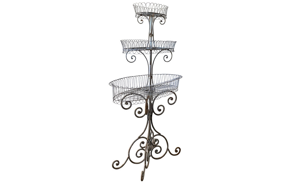 Large French iron wirework florists plant stand with three tiers.