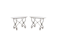 Beautiful, near pair of large 19th Century French iron tables with oval marble tops.