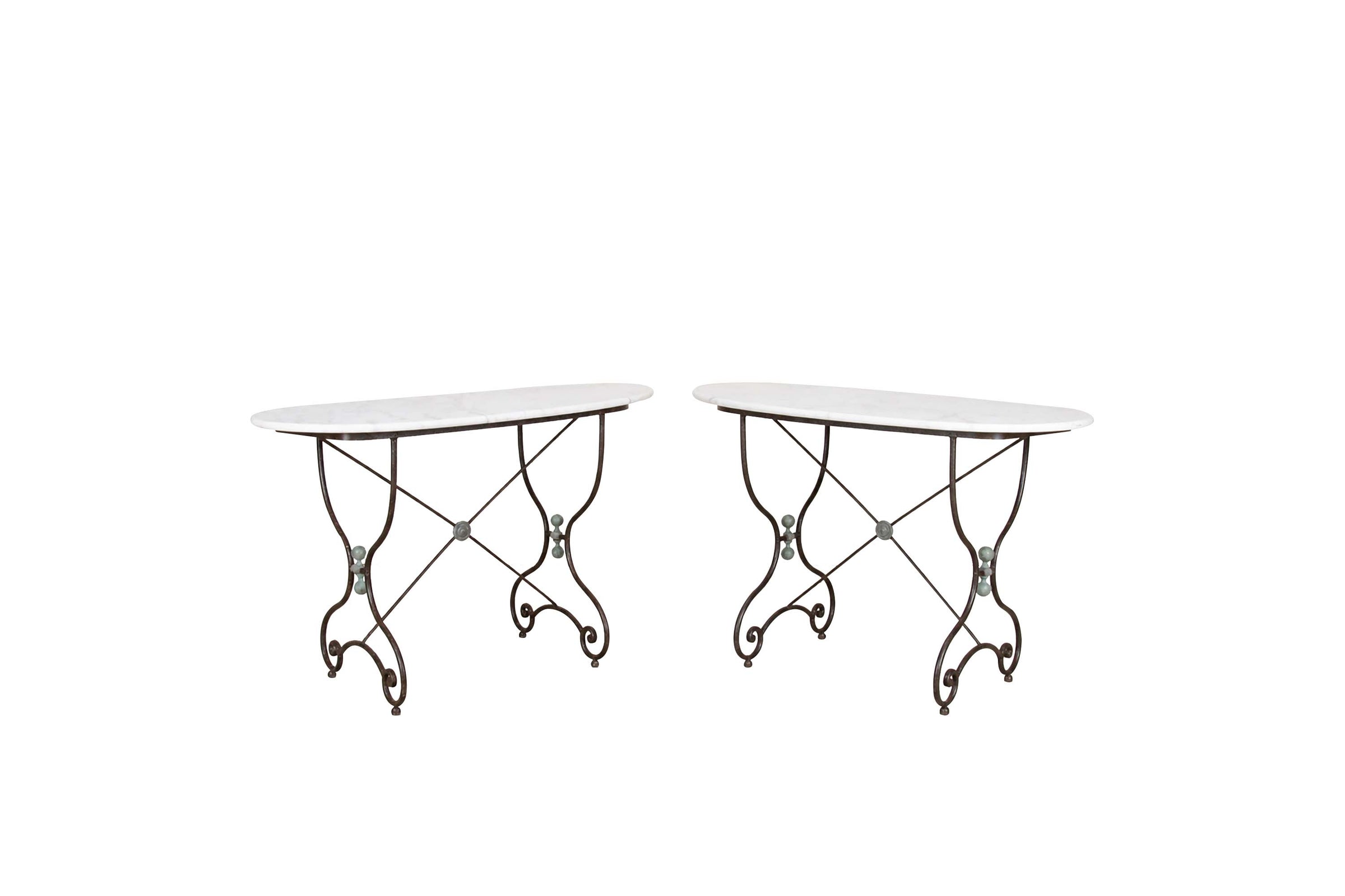 Beautiful, near pair of large 19th Century French iron tables with oval marble tops.
