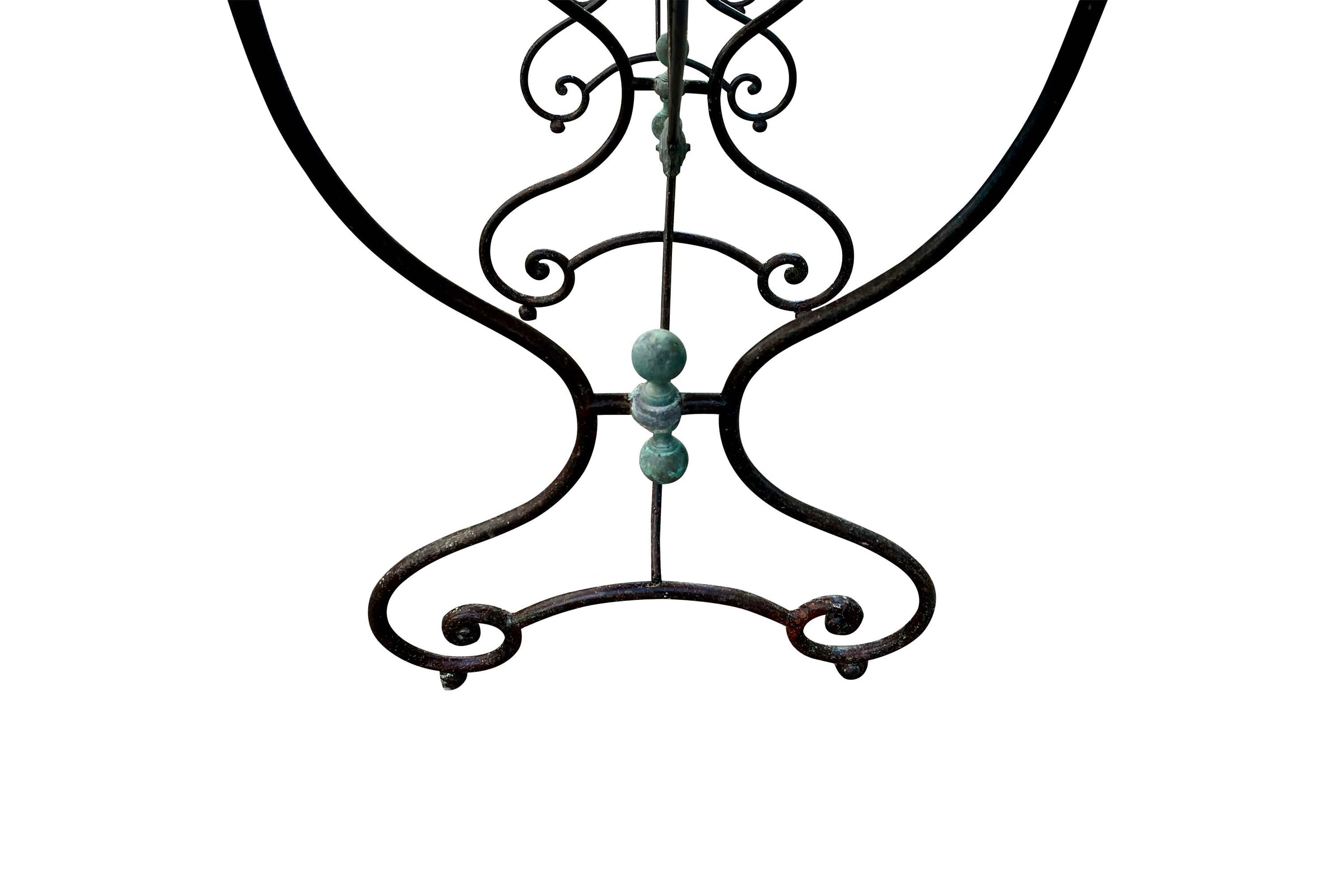 Beautiful, near pair of large 19th Century French iron tables with oval marble tops.