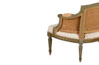 A refined petite 19th Century French sofa in the Louis XVI style.