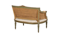 A refined petite 19th Century French sofa in the Louis XVI style.