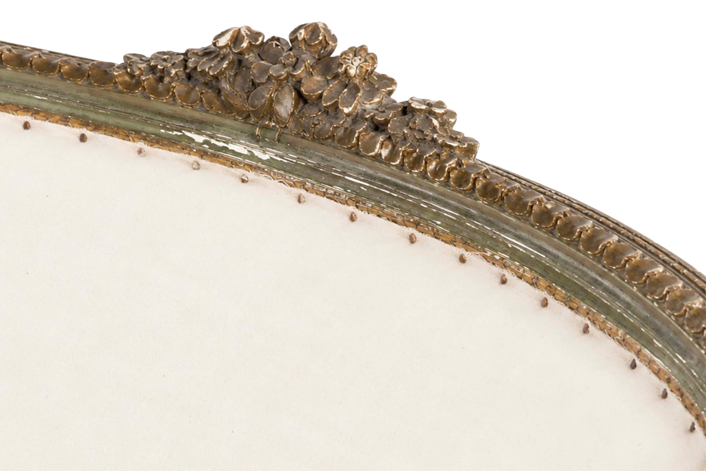 A refined petite 19th Century French sofa in the Louis XVI style.