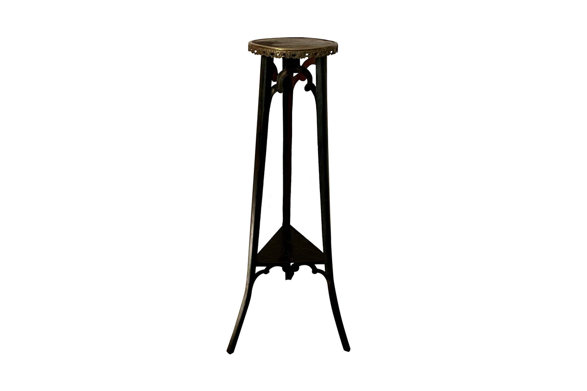 An unusual and highly decorative French Napoleon III pedestal stand in black lacquered tôle peinte, dating to the late 19th century.