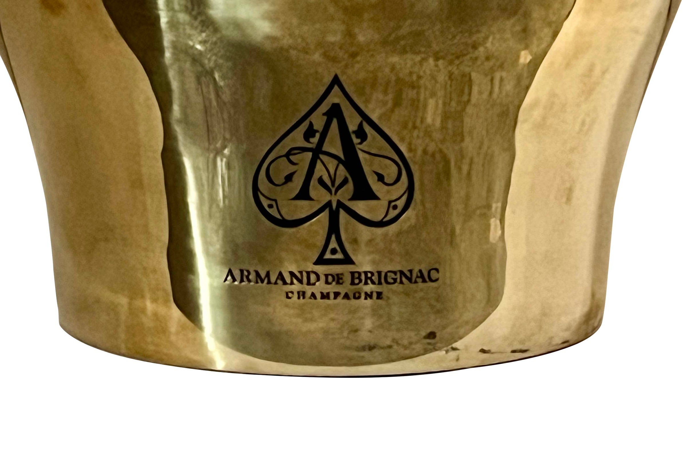 An enormous 'Armand De Brignac' champagne bath in double walled stainless steel with a gold colour finish and deeply embossed ace of spades. 

