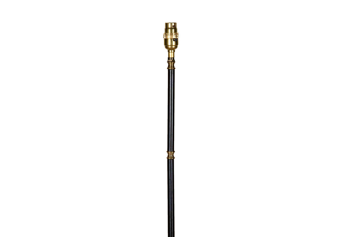 Mid-Century French black metal and brass floor lamp with elegant tripod base and restrained neoclassical styling.