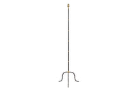 Mid-Century French black metal and brass floor lamp with elegant tripod base and restrained neoclassical styling.