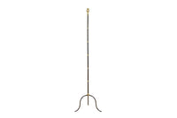 Mid-Century French black metal and brass floor lamp with elegant tripod base and restrained neoclassical styling.