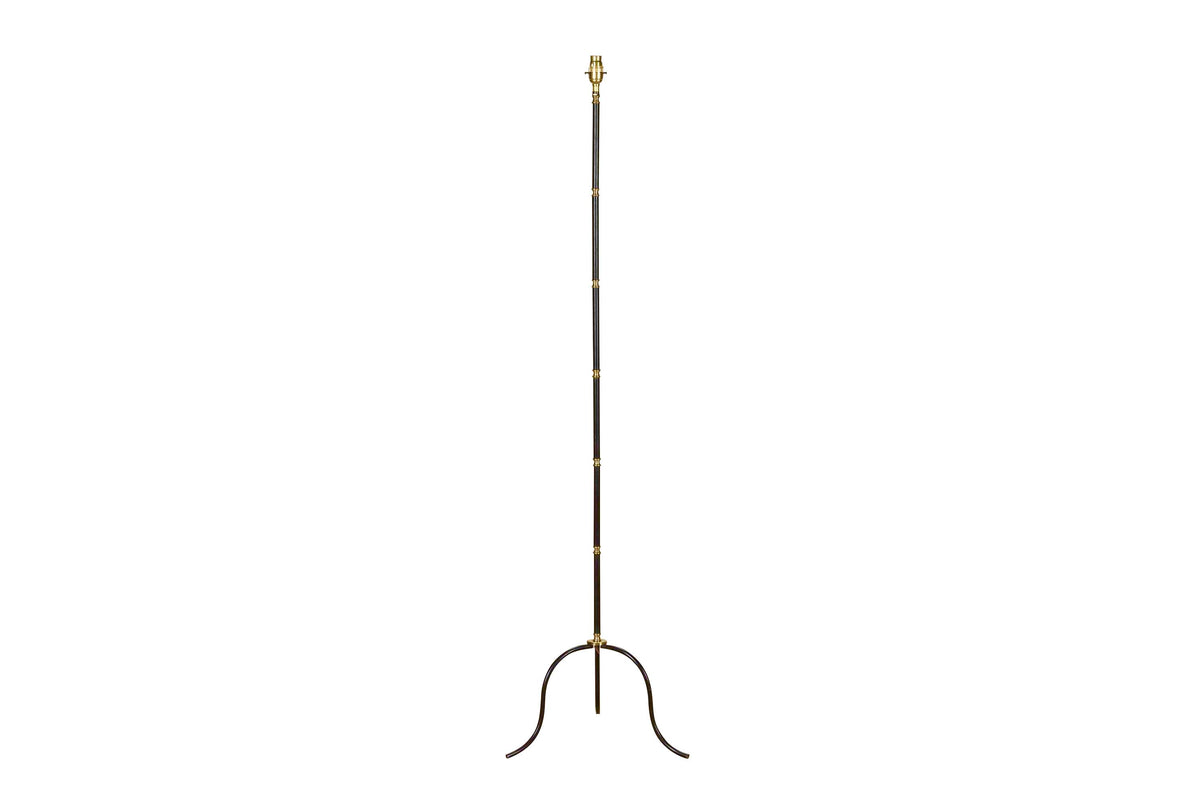 Mid-Century French black metal and brass floor lamp with elegant tripod base and restrained neoclassical styling.