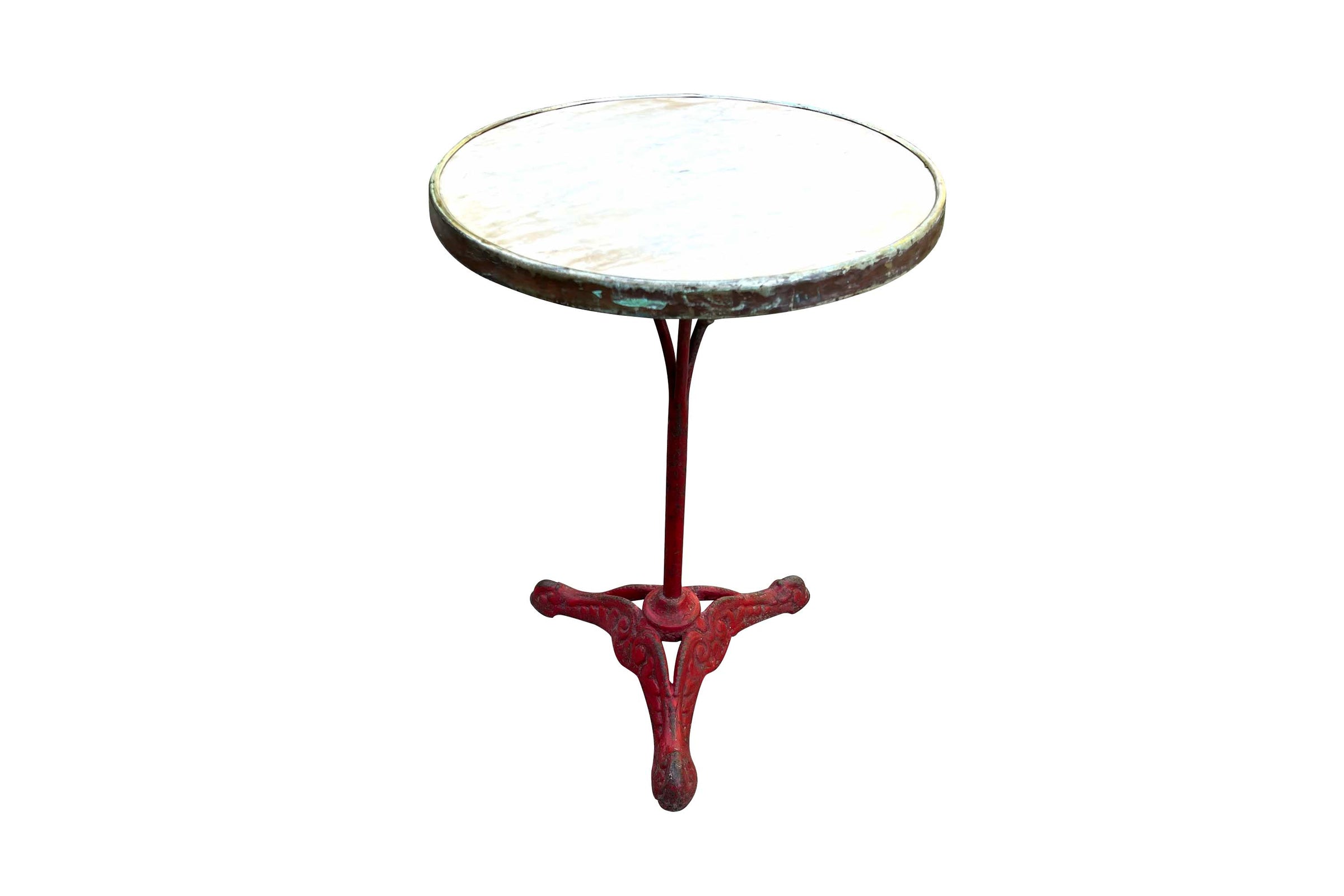 A charming late 19th Century French guéridon or café table, retaining its original cast iron tripod base with scrolling decoration and lovely classic cafe-red painted finish.