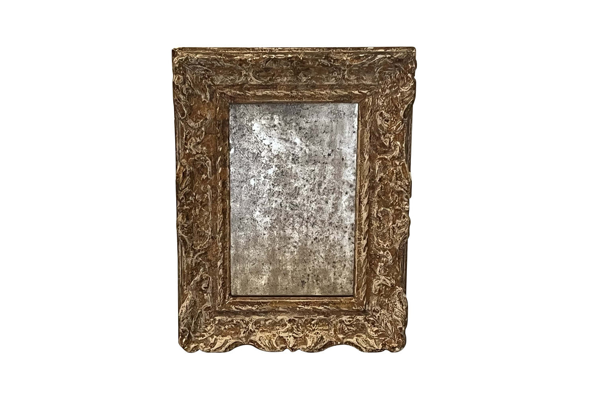 19TH CENTURY FRENCH FOXED MIRROR IN CARVED AND GILTWOOD FRAME