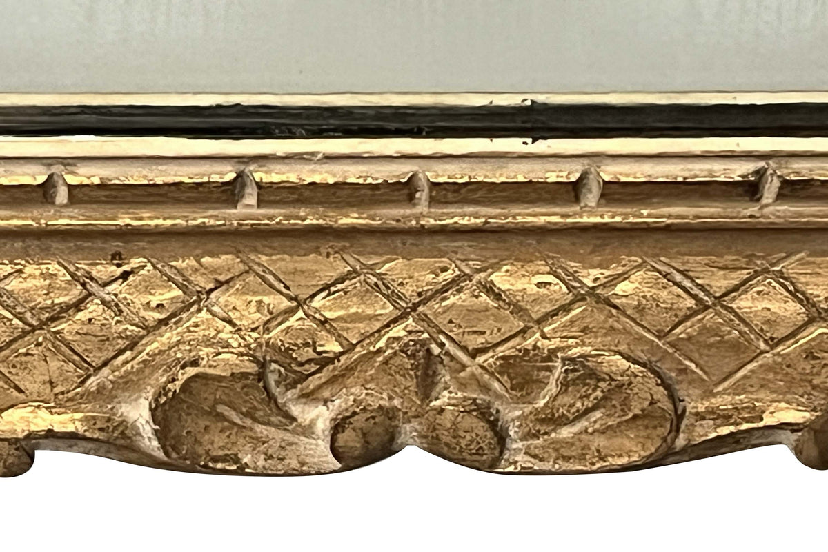 Early 20th Century French carved giltwood wall mirror of rectangular form.