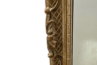 Early 20th Century French carved giltwood wall mirror of rectangular form.